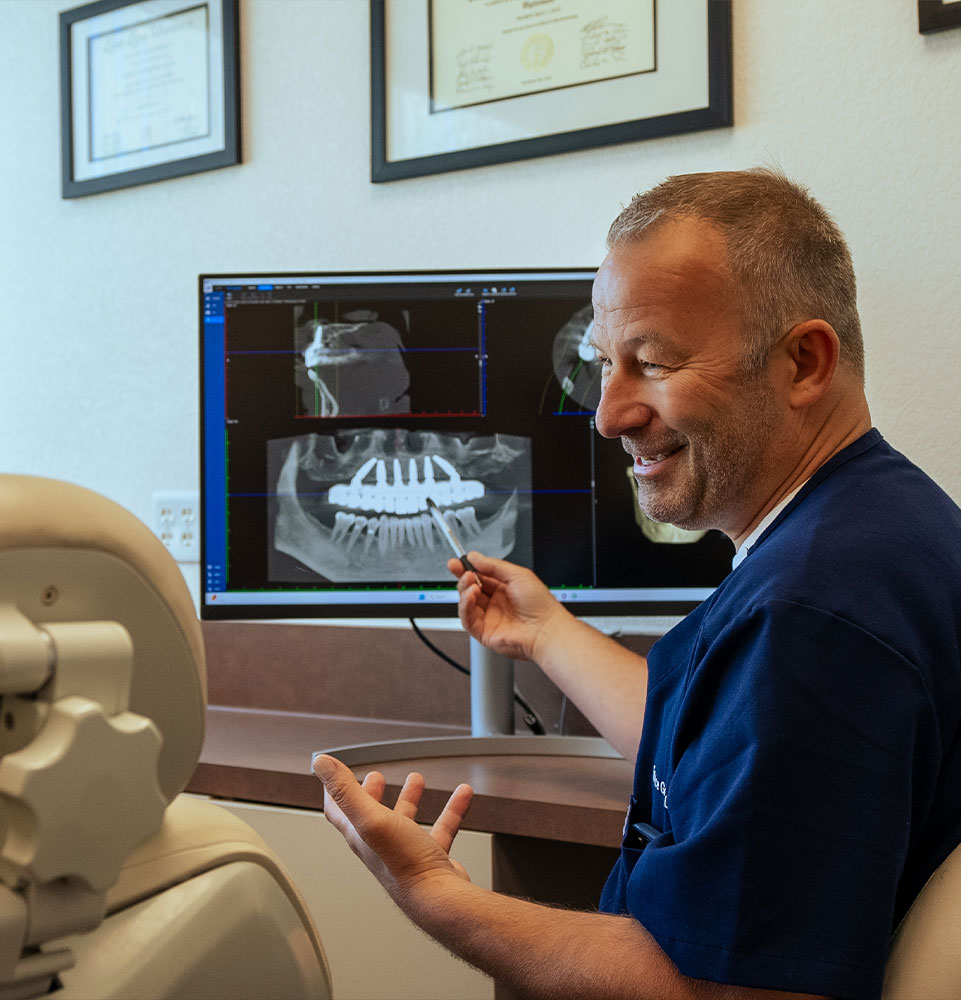 doctor going over dental procedure information with patient