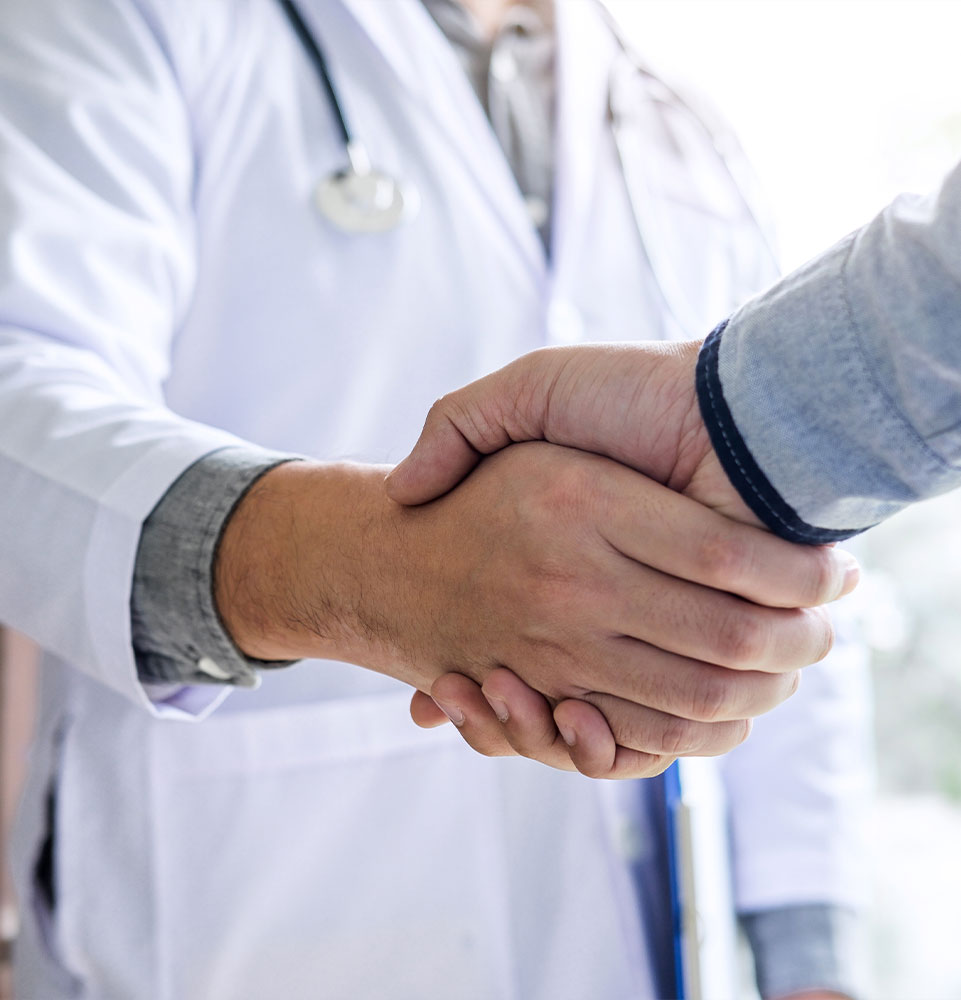 doctor shaking hands with Patient